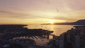 4K aerial horizontal shot of Vancouver Skyline at sunset.
