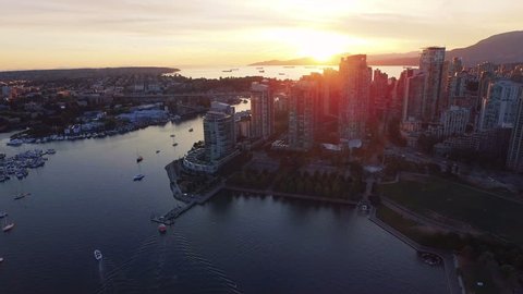 4K aerial shot of Vancouver Skyline at sunset.