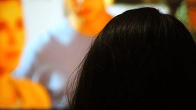 woman watching a movie on the big screen