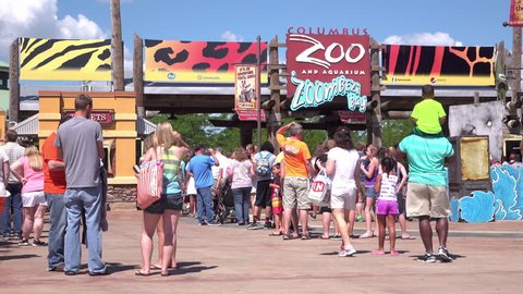 COLUMBUS, OH - AUGUST 1: People waiting in line at Columbus Zoo and Aquarium entrance during hot summer months, recorded in UHD / 4k resolution, on August 1, 2015 in Columbus, Ohio. 