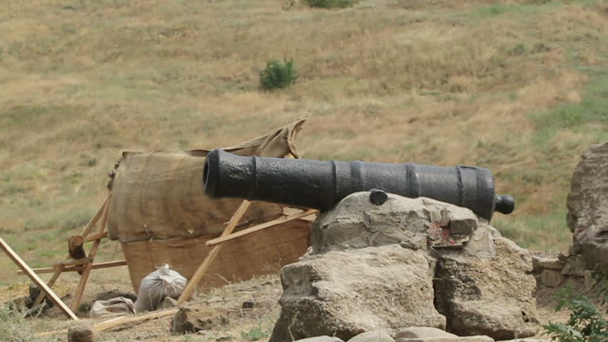 medieval cannon on the rocks