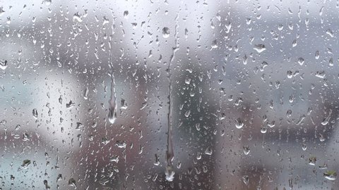Rain on suburban window. Defocused shot. Toronto, Ontario, Canada.