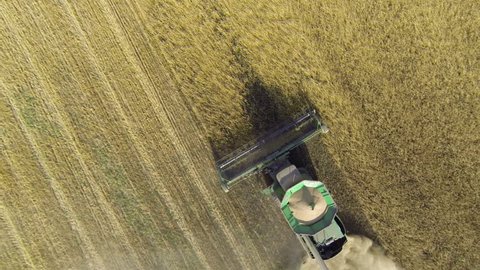 NOVOSIBIRSK REGION, RUSSIA - SEPTEMBER 10: Aerial shot John Deere combine harvesters, September 10, 2015 in Iskitim, Russia