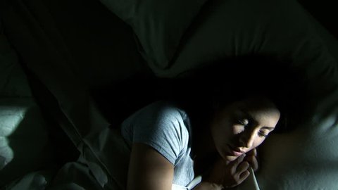 Woman sleeping in bed at night