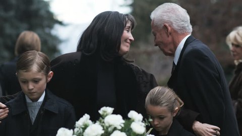 mother and children at a funeral