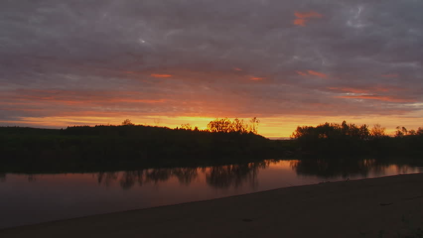 Clouds move over the river at night. Time Lapse/White night in northern