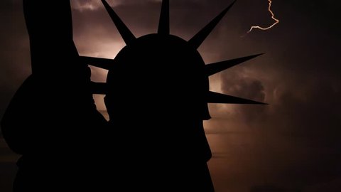 International political, financial and economic crisis,world war, military, apocalypse concept. Loopable video. Silhouette of USA Statue of Liberty on dark background with flashing lightning storm.