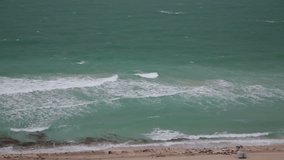 Summer rainy day in Miami beach, USA. Sand Beach and ocean waves. Ocean view from the skyscraper. Full HD, real time video.