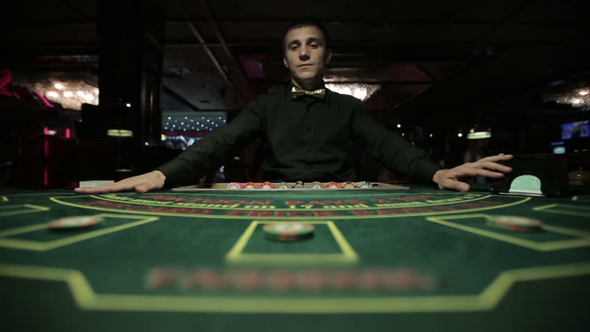 Dealer plays blackjack in casino Royalty-Free Stock Footage #11714060