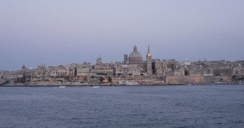 Time-lapse of evening view of Valetta, capital of Malta with fireworks, 4k