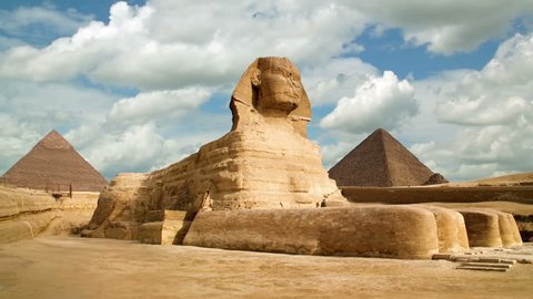 Timelapse of the famous Sphinx with great pyramids in Giza valley, Cairo, Egypt