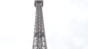 Famous lattice steel construction details of Eiffel tower in Paris France 4K 2160p UltraHD video - French symbol Tour Eiffel against cloudy sky 4K 3840X2160 30fps UHD footage