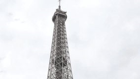 Lattice steel construction details of Eiffel tower in Paris France 4K 2160p UltraHD video - Typical French symbol Tour Eiffel against cloudy sky 4K 3840X2160 30fps UHD footage