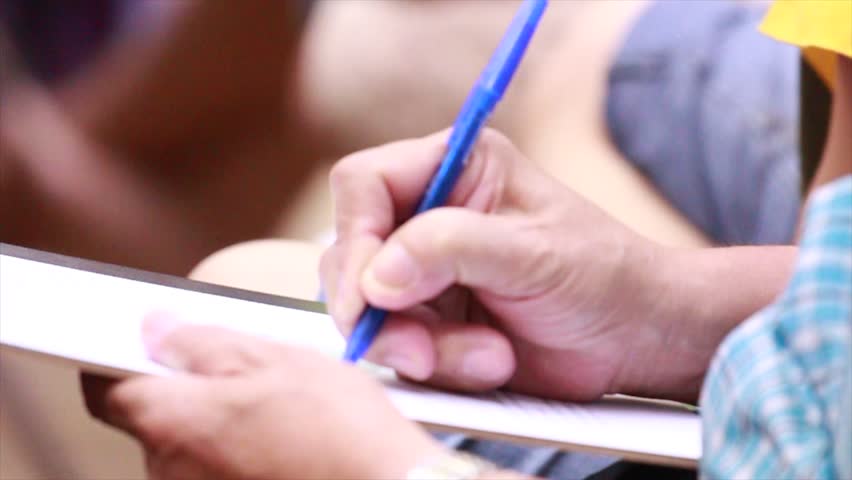 Man is signing his name in a permit. Royalty-Free Stock Footage #11735408
