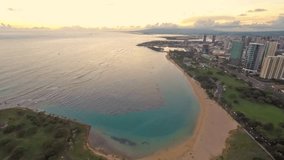 Time lapse aerial sunset over Honolulu, at Ala Moana Beach and Magic Island Beach Park.