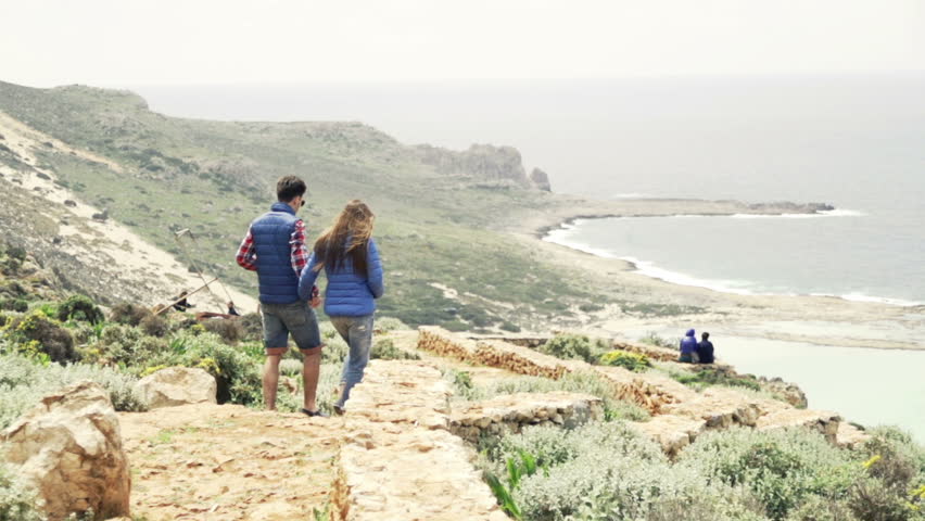 Young couple walking, hiking by sea, slow motion shot at 240fps
