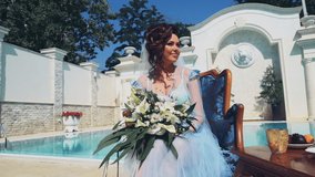 beautiful bride near the luxury pool on the wedding day slow motion