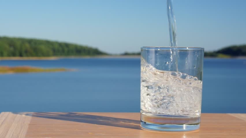 Water Pouring Into Glass Cup Stock Footage Video 100 Royalty Free Shutterstock