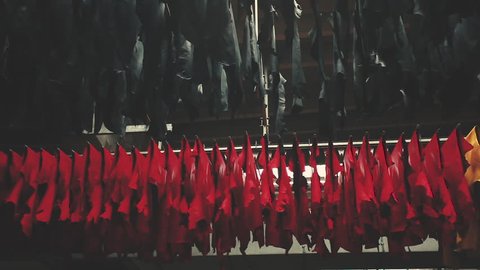 Samples of leather goods on the conveyor hangers