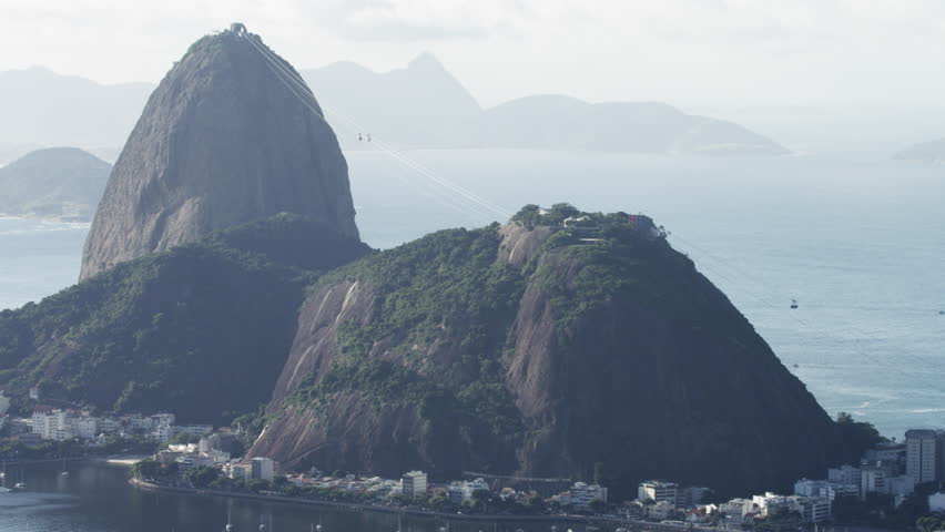 RIO DE JANEIRO - CIRCA JUNE 2013: Static footage of Sugarloaf Mountain and cable cars moving towards the summit.