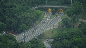 RIO DE JANEIRO - CIRCA JUNE 2013: In this shot of early morning daytime traffic at a tunneled intersection, fewer cars head north. Gradually before the clip ends, traffic picks up again on both sides.