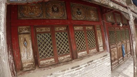 old wooden carved Buddhist temple wall with windows and doors, close-up
Erdene Zuu Buddhist monastery - one of the oldest monuments of Mongolia