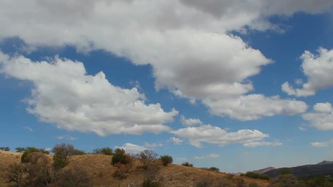 Time Lapse, Clouds roll over Arizona desert grassland hillsides. 1080p