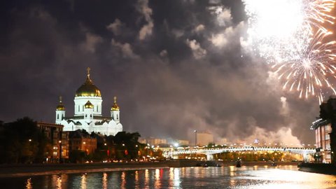 bright fireworks erupt over bridge at Cathedral of Christ Savior in Moscow night sky