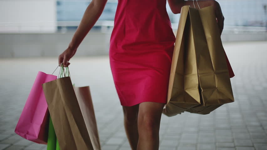 African american woman with shopping bags walking in a city. Close up | Shutterstock HD Video #11786909
