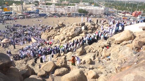 MECCA, SAUDI ARABIA - CIRCA MARCH, 2015: Muslims at Mount Arafat (or Jabal Rahmah). This is the place where Adam and Eve met after being overthrown from heaven.