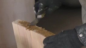 Man causes epoxy adhesive on the Board, manufacturing of wooden stairs