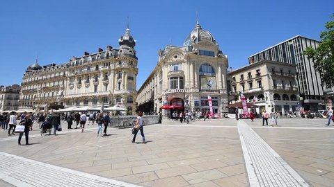 MONTPELLIER, FRANCE - MAY 22, 2015: People are walking on the Place de la Comédie square, main focal point of the city of Montpellier