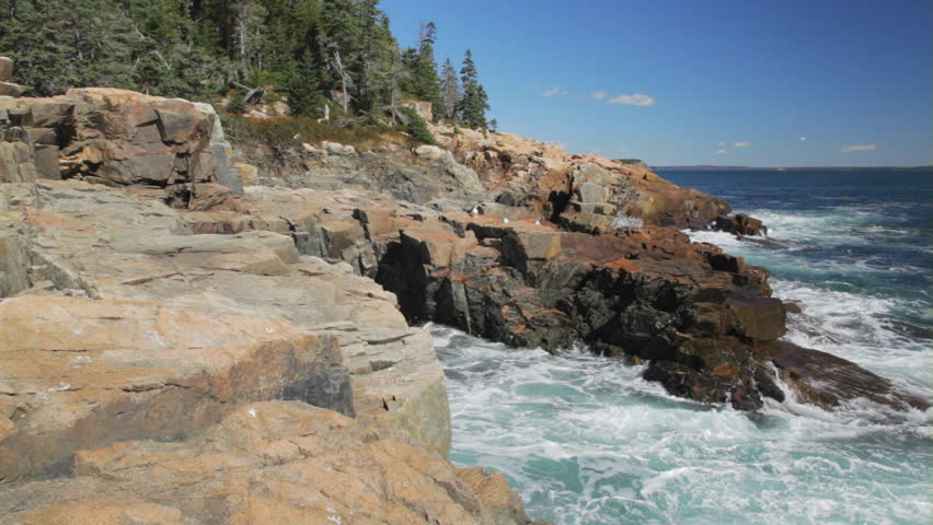 Waves crashing against the granite cliffs of Otter Point in Acadia National Park, Maine.