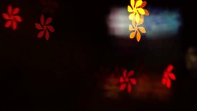 Golden, blurred, bokeh lights background. Abstract sparkles. Flower shapes. 4K