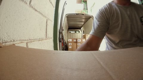 Loading the van with goods to be transported and delivered. Cinematic Premium Video.
