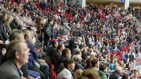 Chelyabinsk, Russia - September 19, 2015: Fans happily respond to the goal scored in the hockey game.