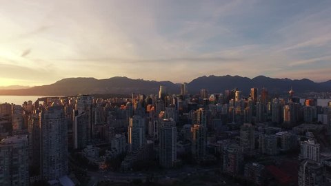 4K Aerial drone dramatic shot over Vancouver at sunset in Canada