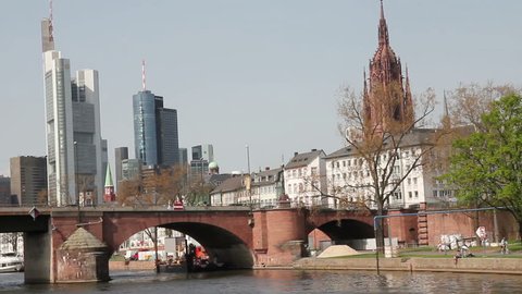 Riverside, bridge and skyline of Frankfurt with church Stock Video
