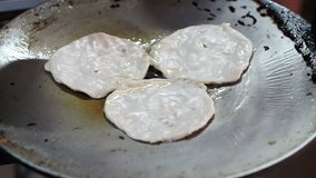 Video The making of Indian pancake,Roti Bread with hot pan, oil and butter