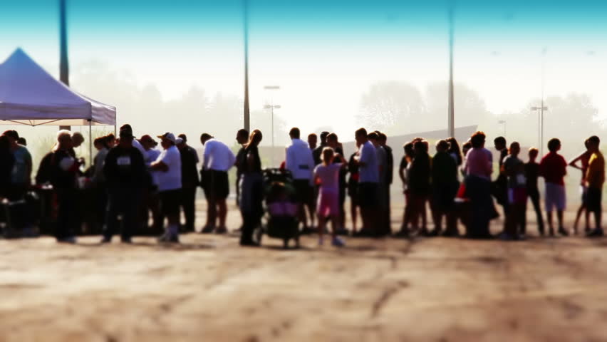People wait in line outside on an early morning to register before a race or