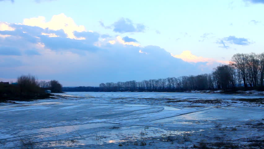 spring lake landscape with melting ice - timelapse