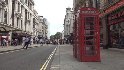 UNITED KINGDOM, LONDON, AUGUST 2015: Red Phone Booth Traditional Symbol Telephone Box London Landmark Tourism Street