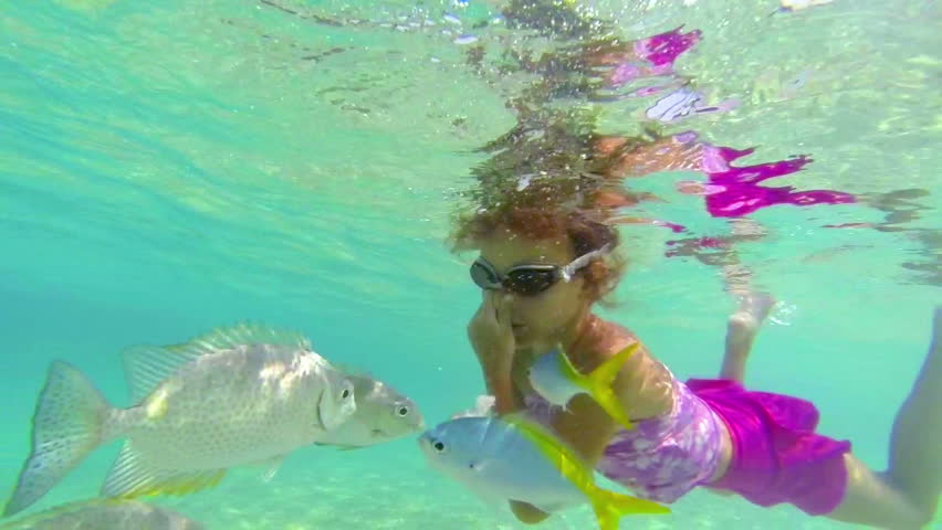 Girl snorkelling underwater
