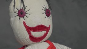 Hand made jester puppet scary cotton doll slow panning 4K 2160p 30fps UltraHD footage - Scary buffon  eyes and smile doll 4K 3840X2160 UHD video