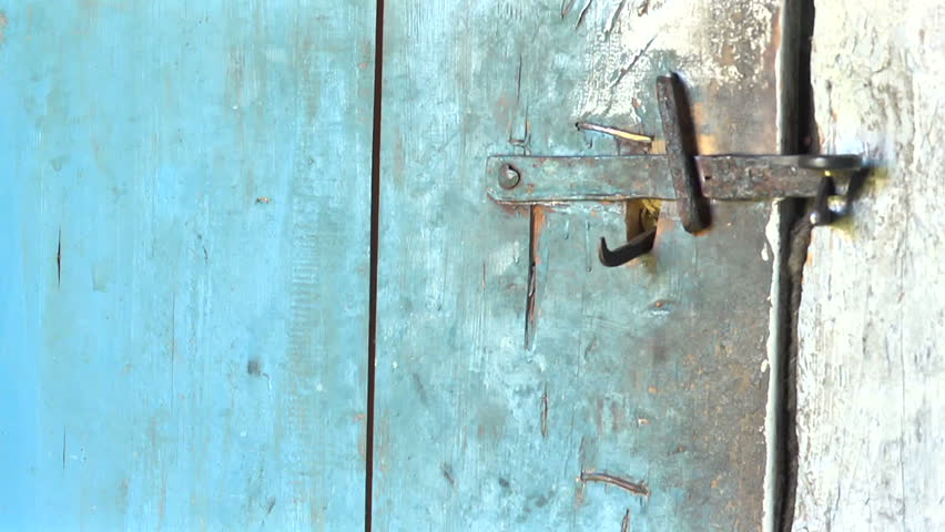 Key unlocking a door latch, and door opens  into the  room, where another door opens into the black background Royalty-Free Stock Footage #11864519