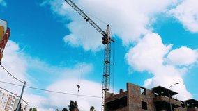 Crane builds house. UHD 4K Time Lapse video