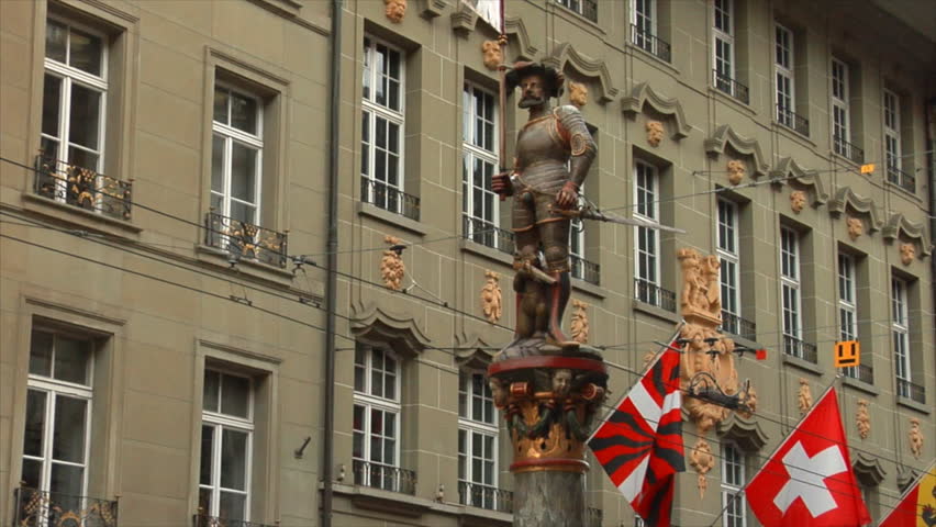 Bern (Berne), Switzerland. Shuetzenbrunnen Fountain, a XVI century statue of a marksman on the Marktgasse street.