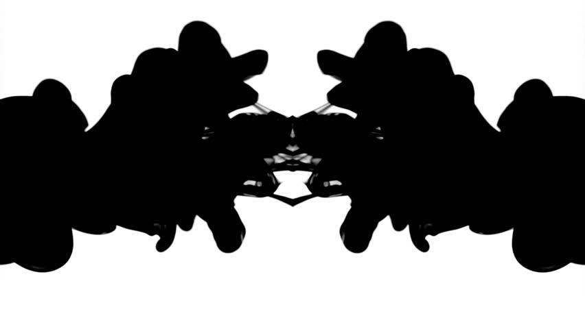 Black ink in water, reflected like a Rorschach inkblot test, moving gracefully