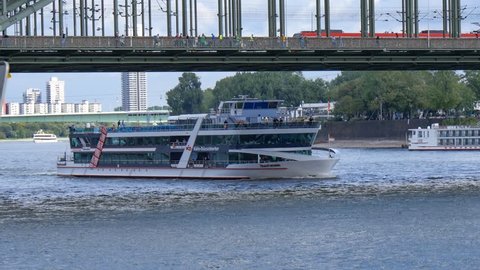 Cologne, Germany - SEP 21, 2015: This is a quay view of Rhine river and Hohenzollern railway bridge in Cologne, Germany