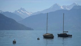 Boats floating on lake Thun Bernese Oberland Switzerland
